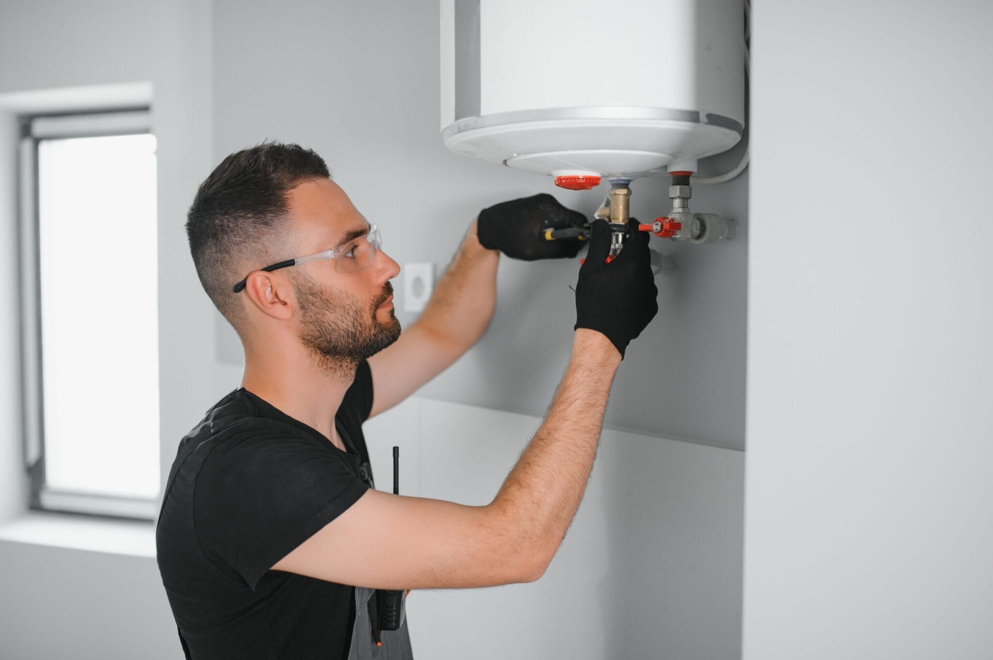 Professional,Plumber,Checking,A,Boiler,And,Pipes,,Boiler,Service,Concept.